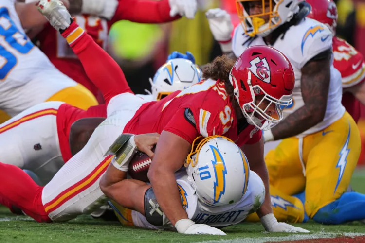 Harbaugh says Chargers will evaluate everything after 22-6 loss to Chiefs drops them to 0-6